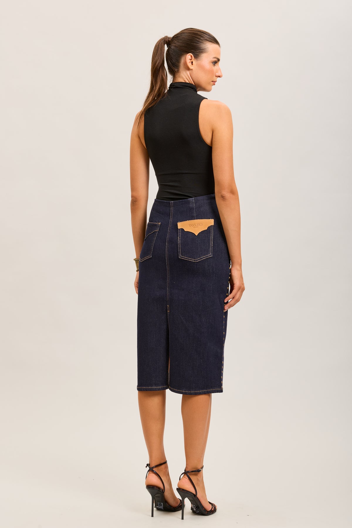 Toxik3 mid-length stretch straight denim skirt with slit stud details