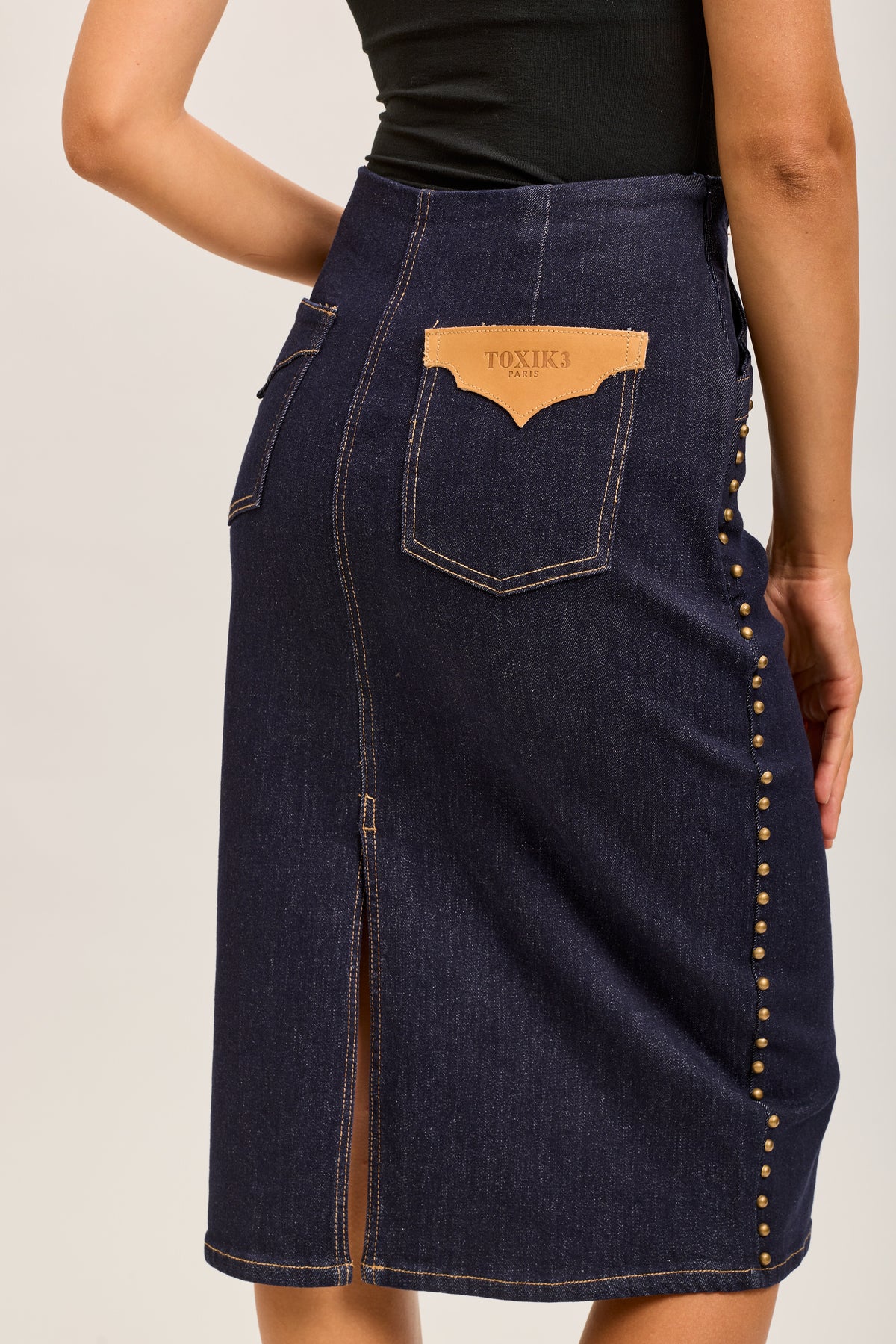 Toxik3 mid-length stretch straight denim skirt with slit stud details