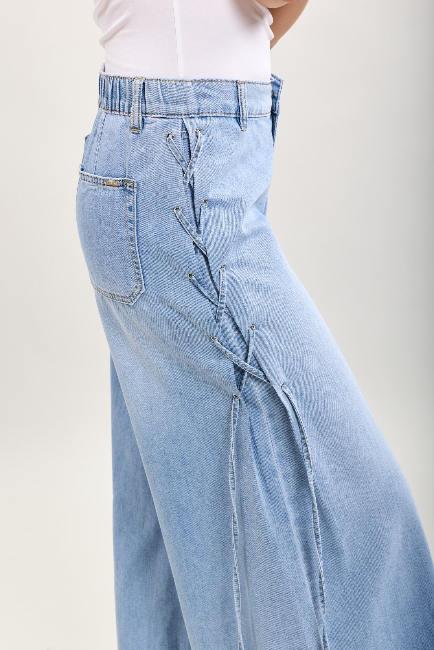 Toxik3 extra-wide stretch denim pants with side lace details