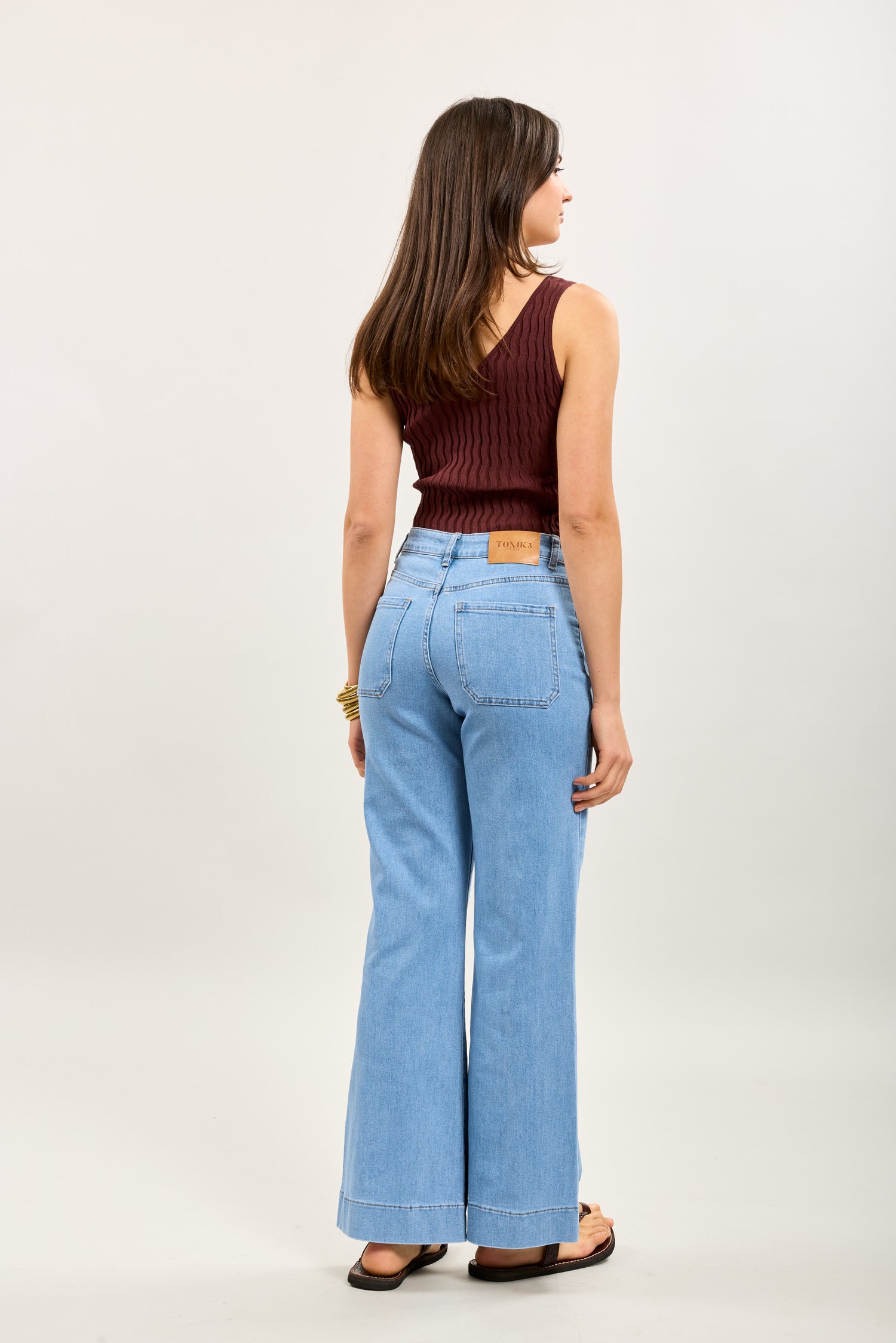 Toxik3 high-waisted flare jeans with gold button bridge
