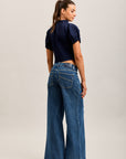 Weite Stretch-Jeanshose von Toxik3 mit Ausschnitten und Taschen