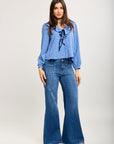 Toxik3 stretch flare jean pants with metal eyelets and lacing